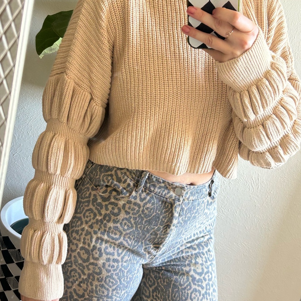 Elegant Beige Sweater with Textured Sleeves